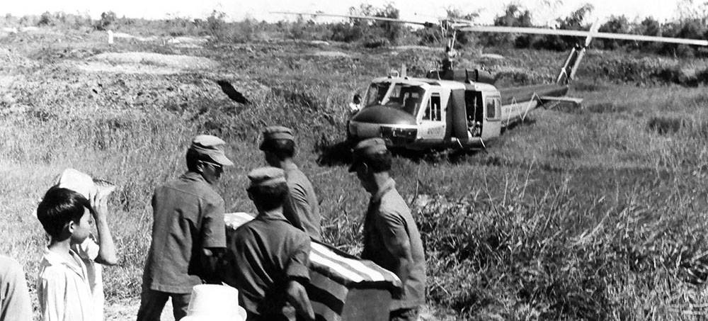Vietnam (ARVN) soldiers carried the possible remains of SP/4 Valentine B. Vollmer