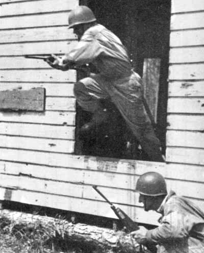 One 66th ID Ranger covers another as he charges out of a ‘Naziville’ building