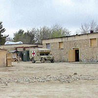 Exterior of the CJSOTF-A aid station set up and manned by personnel of the Medical Platoon, Group Support Company, 3rd Special Forces Group, April 2002.