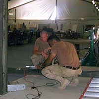 Construction of the large utility tent housing the Joint Operations Center (JOC)  and other office spaces.