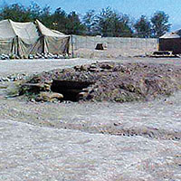 Two types of underground bunkers provided soldiers with protection from indirect fire.  These were located near sleeping areas and work stations for use during rocket or mortar attacks. The troops regularly rehearsed emergency actions.