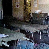 Interior of the CJSOTF-A aid station, organized to receive casualties in the event of an attack. The most severe casualties would be transported to the Emergency Medical Station (EMS) or evacuated to the nearest hospital as appropriate.