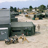View of ‘Camp Abel’ looking out over billeting and working area tents, May 2002. 