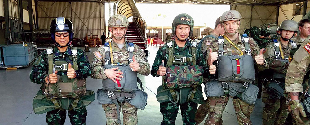 Combined parachute jump during the 36th consecutive Operation COBRA GOLD. COL Guillaume Beaurpere (1st SFG CO) is flanked by COL Janma (L), CO of RTA 5th SF Regt), and LTC Puwadoen (CO, 1/5 SF Bn).