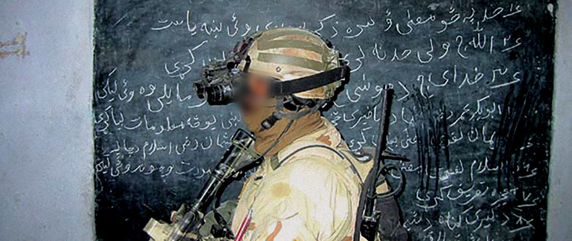 Special Forces soldier from ODA 511 conducting Sensitive Site Exploitation (SSE) of Objective BRIGID.
