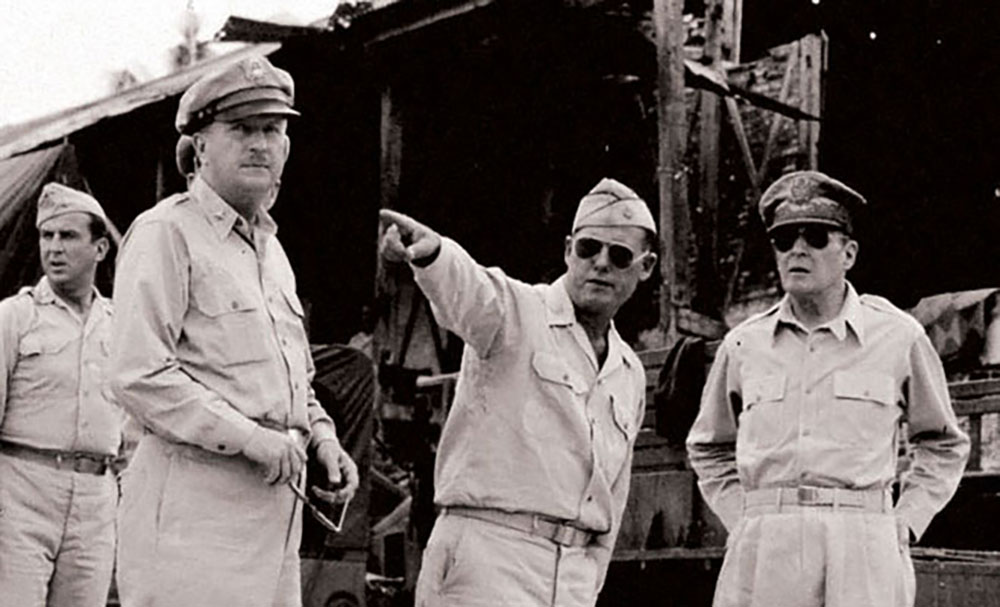 General of the Army (GEN) Douglas A. MacArthur and members of his staff visit the site of the Palawan Massacre. The mass execution at Palawan triggered several rescue operations to ensure similar massacres did not take place.