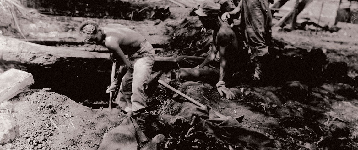Medical personnel excavate bodies of American soldiers from Shelter A.