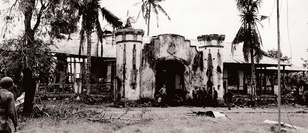 Signal Corps photo of the entrance to Camp 10-A, Puerta Princesa, Palawan, Philippine Islands.