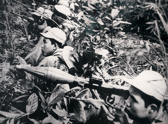 Pathet Lao soldiers in combat during the Laotian Civil War