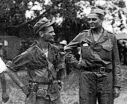 CPT Robert Prince and COL Horton V. White discuss the rescue mission in Guimba, Luzon