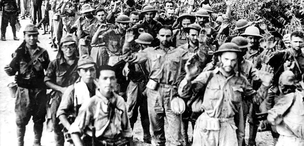 Japanese Army soldiers force marched American prisoners to camps in the middle of Luzon during the ‘Bataan Death March.’