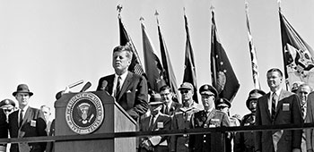 President Kennedy addressed the “famous 82nd Airborne Division,” emphasizing that their last overseas duty was in Berlin at the end of World War II. Then, he stressed that “conventional warfare included guerrilla warfare, anti-guerrilla warfare, counter-insurgency action, and psychological warfare.”