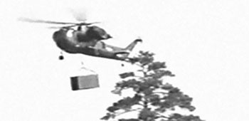 A CH-37 Mojave, medium helicopter demonstrated its external sling-load carrying capability with a  CONEX storage container.