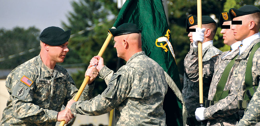 CSM George L. Hines* receives the battalion guidon from LTC Steven A. Warman