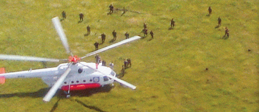 Aerial view of Operación JAQUE with FARC guerrillas approaching the helo.