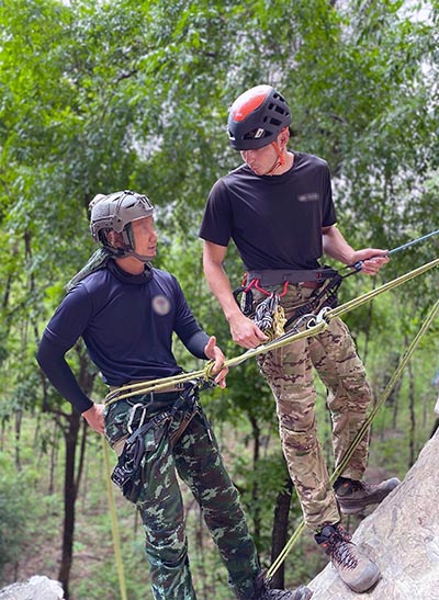 Members of the 320th Special Tactics Squadron, Royal Thai Army, share mountaineering techniques with their U.S. Army 1st Special Forces Group (SFG) counterparts in Thailand, 20 April 2022. A strong, forward-looking American-Thai defense alliance bolsters the U.S. national defense strategy of countering near-peer threats in the Indo-Pacific region.