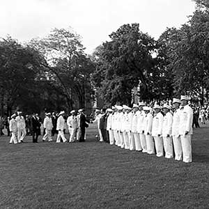 JFK proceeds from the honor guard area to meet other senior military leaders on The Plain. At the far right of the photo are retired MG Henry Clay Hodges, Jr., West Point Class of 1881, and three cadets who Kennedy had nominated to the Academy when he was a U.S. Senator: Peter J. Oldfield, David G. Binney, and Kevin G. Renaghan.