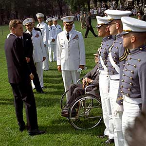 JFK speaks with MG (ret.) Hodges (in wheelchair) just before greeting his past USMA nominees, Cadets Oldfield, Binney, and Renaghan. Westmoreland is to Hodges' immediate right.
