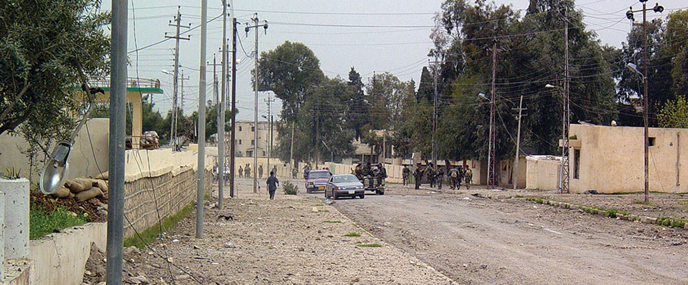 The streets of Ayn Sifni reflect the damage sustained as the coalition forces swept through the village during the battle.
