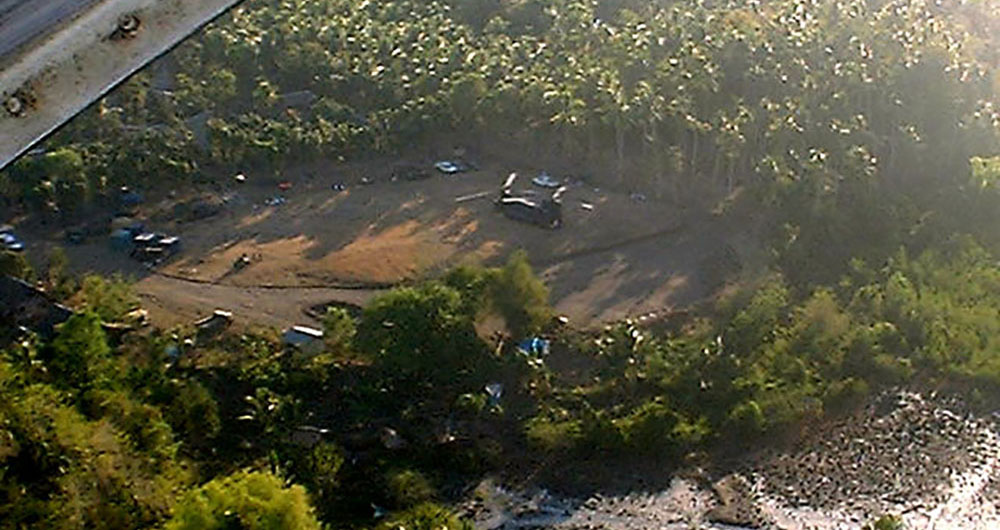 Aerial view of the jungle landing zone with Wild 41 undergoing maintenance by the Downed Aircraft Recovery Team.