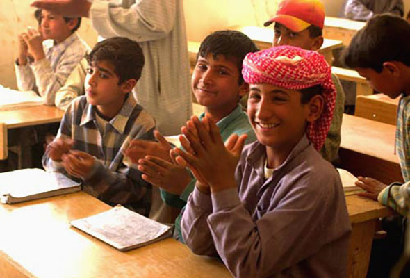 The 422nd Civil Affairs Battalion spent a week in the area around Najaf, which gave it time to conduct humanitarian assistance and other aid missions. Through the efforts of the battalion, and the generosity of individual soldiers, on 4 April 2003 these children attended classes at their newly reopened school.