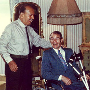 Jim Cloud in the president’s wheelchair with General Velasco Alvarado after he walked without crutches wearing his new Cloud-built leg.