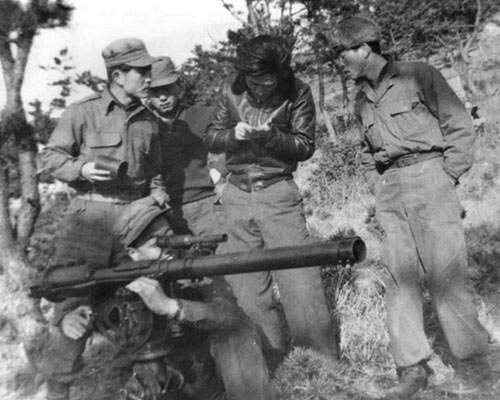 SMG interpreter Chong Do-hyun sighting the 57mm recoilless rifle. He was later killed on an SMG mission.