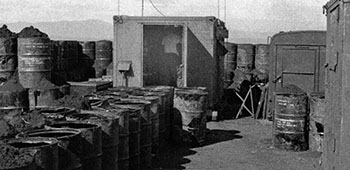 View of the force protection for the radio system. The 55-gallon drums were filled with dirt. Two rows of drums served as the base with a third row on top to protect the facility from rocket and mortar fire.