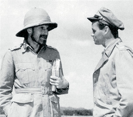 Seen here in 1944 wearing his characteristic pith helmet, Major General Orde Wingate discusses plans with Colonel Philip Cochran of the U.S. 1st Air Commando.