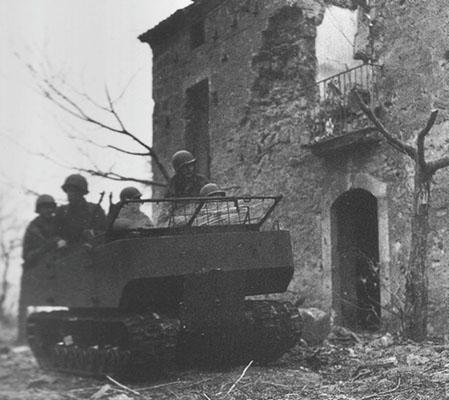 Men of the FSSF in the T-24 Weasel moving out of an area under mortar bombardment.