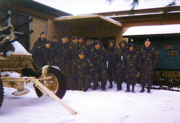 SOD-JF members pose for a group photo in the snow outside the 5th SFG headquarters at Fort Campbell, Kentucky, December 2002. The anti-aircraft gun in the foreground was captured by the 5th SFG during Operation DESERT STORM.