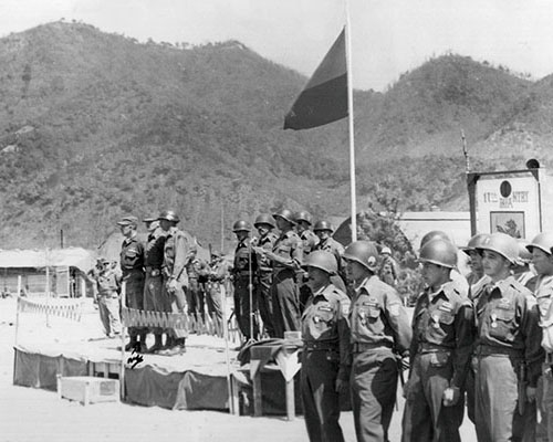Batallón Colombia award ceremony for Operations BARBULA and Old Baldy. Note the Colombian “Rampant Lion of Infantry” sign to the right.