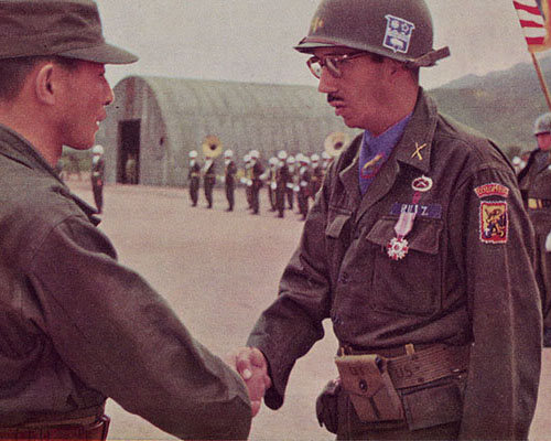 Lieutenant Colonel Alberto Ruíz Novoa being congratulated by General Paik Sun Yup, Chief of Staff, Korean Army, after being awarded the “Ulchi Order of Military Merit” at the 7th Infantry Division headquarters on 19 June 1953.