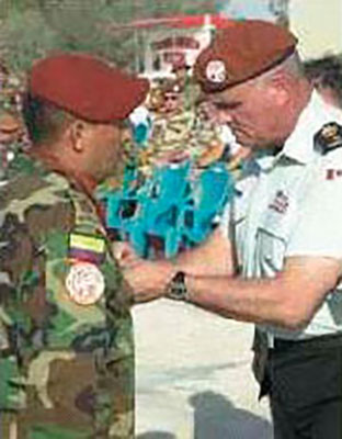 A Colombian soldier being awarded the MFO medal