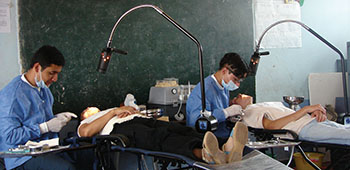 Colombian volunteer dentists provide basic dental care to locals in Fusagasugá. In this case they are operating in a local schoolhouse. Schools are often used to support Civil Affairs missions.