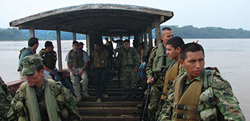 Civil Affairs soldiers find themselves using a variety of transportation to accomplish their mission. In this case the best way to Solano is via the Caquetá River. The Colombian soldier on the right is wearing the new digital camouflage pattern uniform.