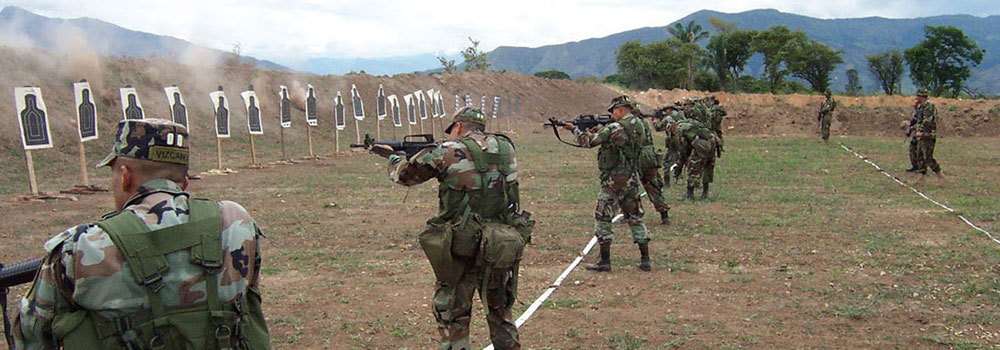 U.S. Army Special Forces soldiers training BACOA troops on the range at Tolemaida.