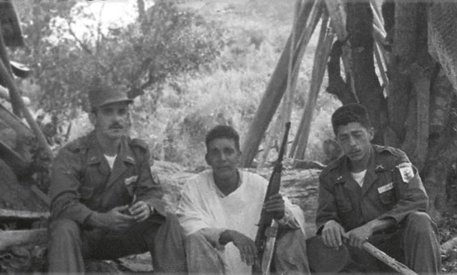 Colombian First Lieutenants Roberto Fernández Guzmán, Vallejo, and Muñoz (left to right) at tactical objective.