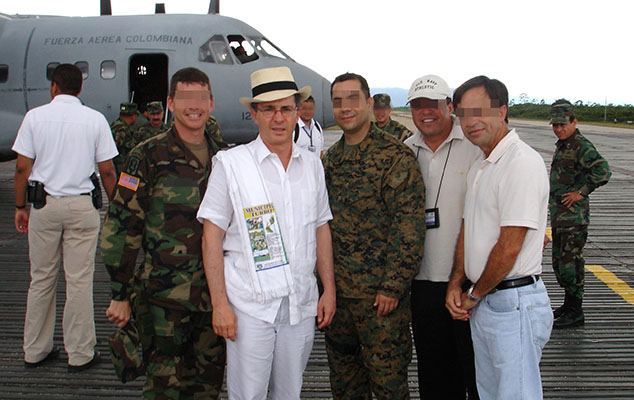 President Alvaro Uribe Vélez with U.S. military and Embassy staff during a tour of the Tres Equinas Air Force base.