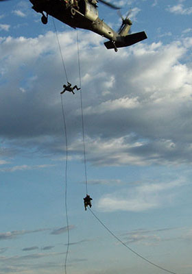 Standard rappelling technique. This takes longer and exposes both the helicopter and the soldiers to enemy fire.