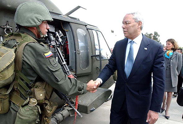 Then Secretary of State Colin Powell reviews the Colombian National Police during his visit in December 2002.