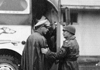 Leaving Fort Riley by bus during a storm on 12 July 1951. LTC Shields says goodbye to Colonel “Whitey” Gruber. The five-day rainstorm flooded the area and most of Kansas.