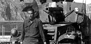 Private William E. Ketchens of the Ranger Cannon Company with the M-3 Half-track.