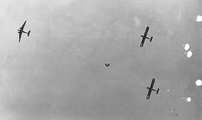 Seen from the ground are 551st paratroopers exiting the towed gliders.
