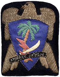 The unofficial insignia of the 551st Parachute Infantry Battalion. The Spanish motto “Aterrice y Ataque,” means “Land and Attack.”