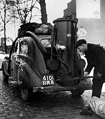 1930s French Renault sedan has a charcoal burner installed in the trunk.