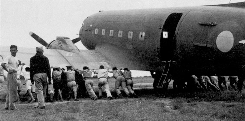 A British-operated C-47 Dakota being turned around at Phu Khieo airfield in Thailand June 1945.
