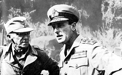 Lieutenant General Joseph Stilwell and Admiral Lord Louis Mountbatten confer in March 1944. Notice that Stilwell, associated with his other role as Commanding General, Chinese Army in India, is wearing a Chinese Army cap.