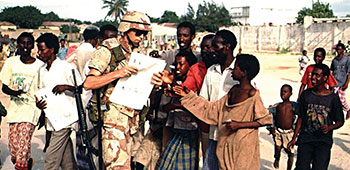 9th PSYOP Battalion soldier distributing RAJO newspaper in Kismayo.