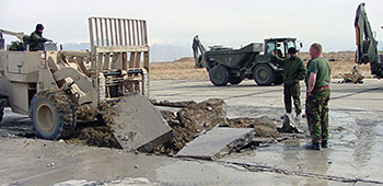 The removal of broken concrete slabs was the first step to repairing the damaged runway.